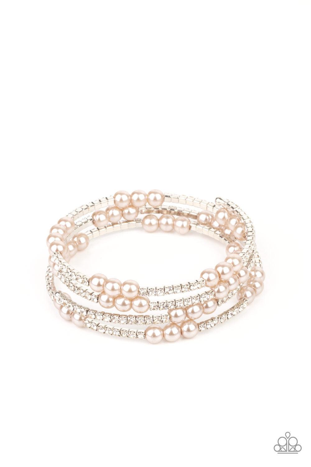 Paparazzi Accessories Hollywood Hospitality - Brown Sparkly sections of glassy white rhinestones and classic brown pearls are delicately threaded along a coiled wire, creating a glamorous infinity wrap style around the wrist. Sold as one individual bracel