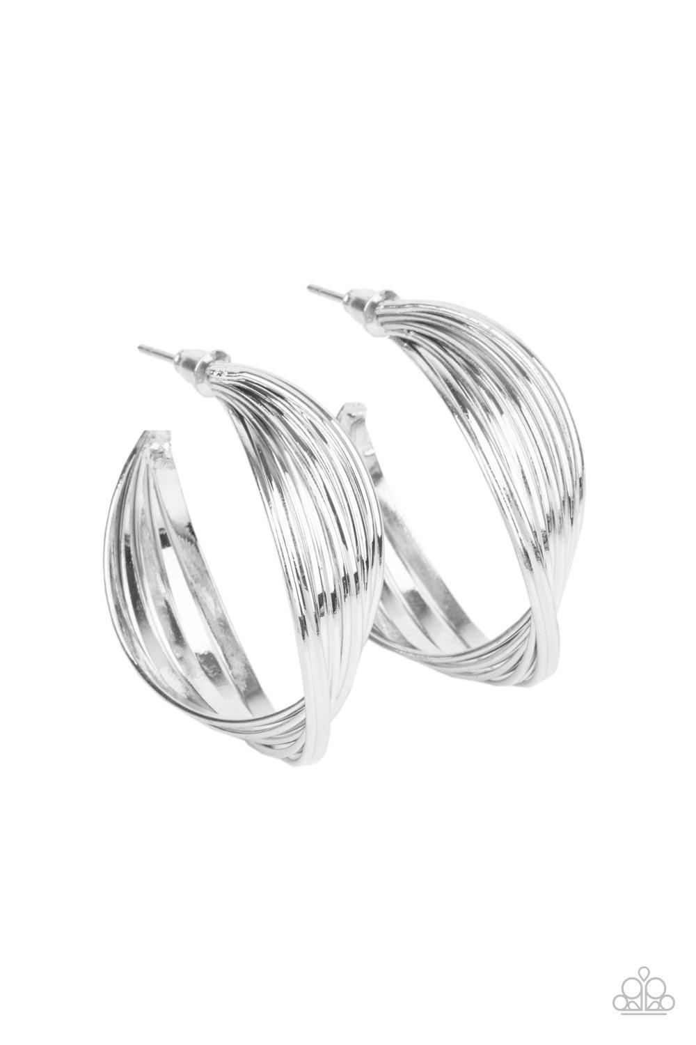 Paparazzi Accessories Curves In All The Right Places - Silver A stack of shiny silver hoops delicately twists at the center, creating a curvaceous display. Earring attaches to a standard post fitting. Hoop measures approximately 1 1/4" in diameter. Sold a