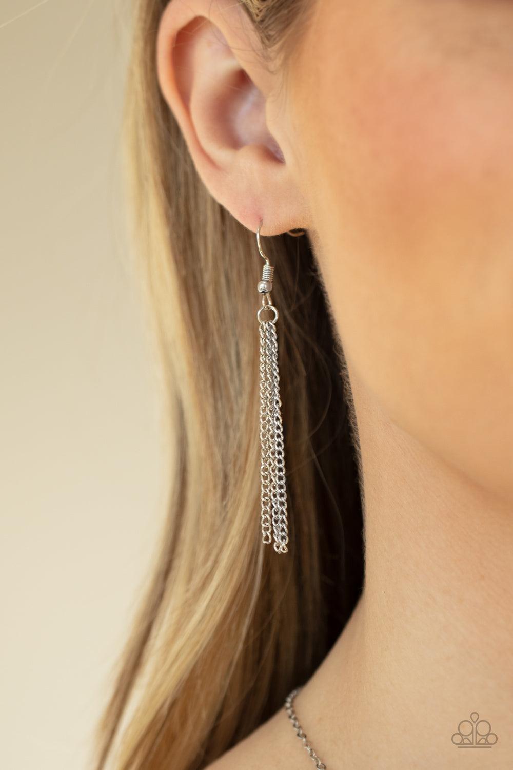 Paparazzi Accessories She Works HEART For The Money - Pink Cut into a flirtatious heart shape, a dramatically oversized pink rhinestone pendant swings from the bottom of a dainty silver chain below the collar for a glamorous finish. Features an adjustable