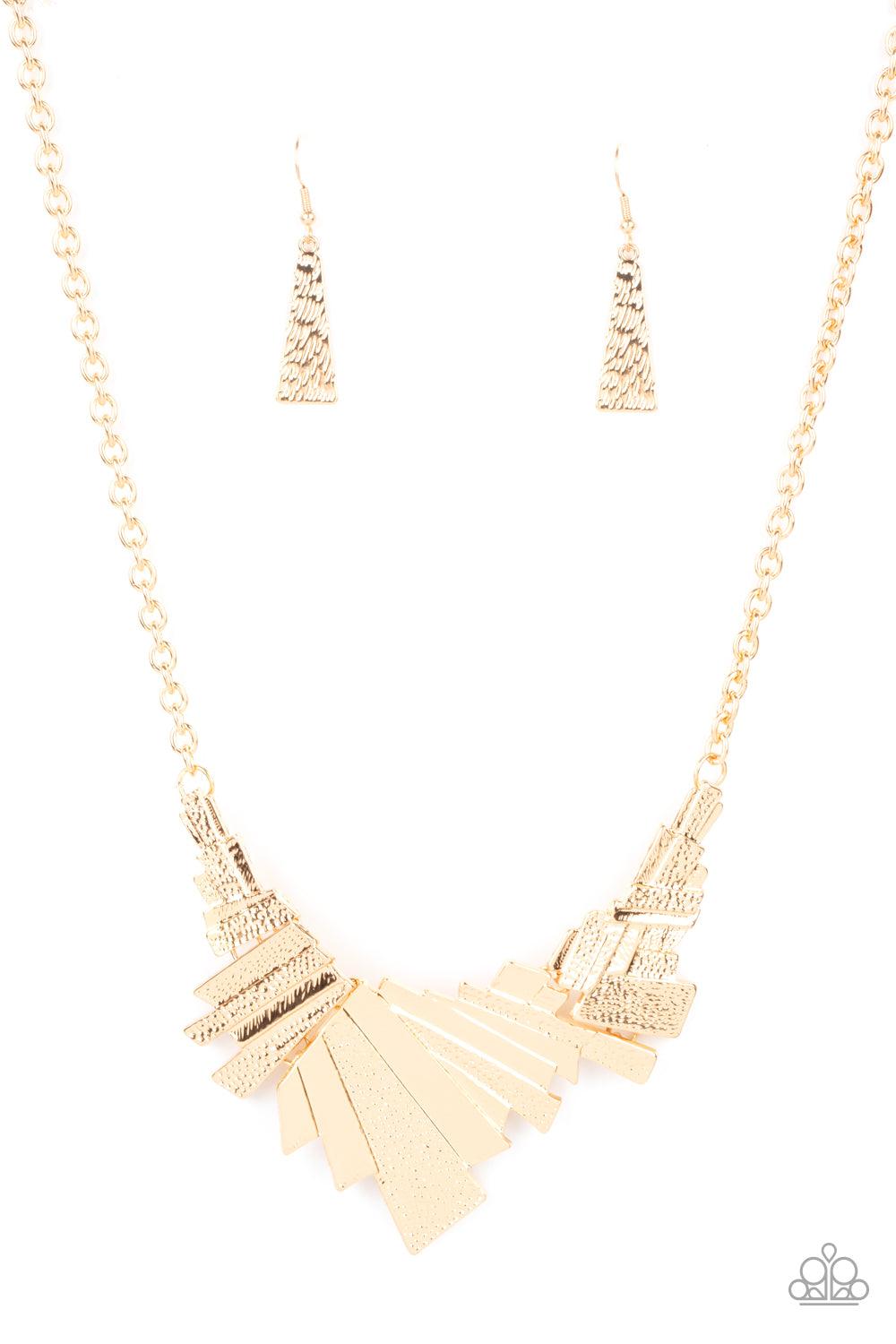 Paparazzi Accessories Happily Ever AFTERSHOCK - Gold Varying in hammered detail, a collision of rectangular gold frames connect into three shockingly shimmery plates below the collar for an intense industrial inspired look. Features an adjustable clasp cl