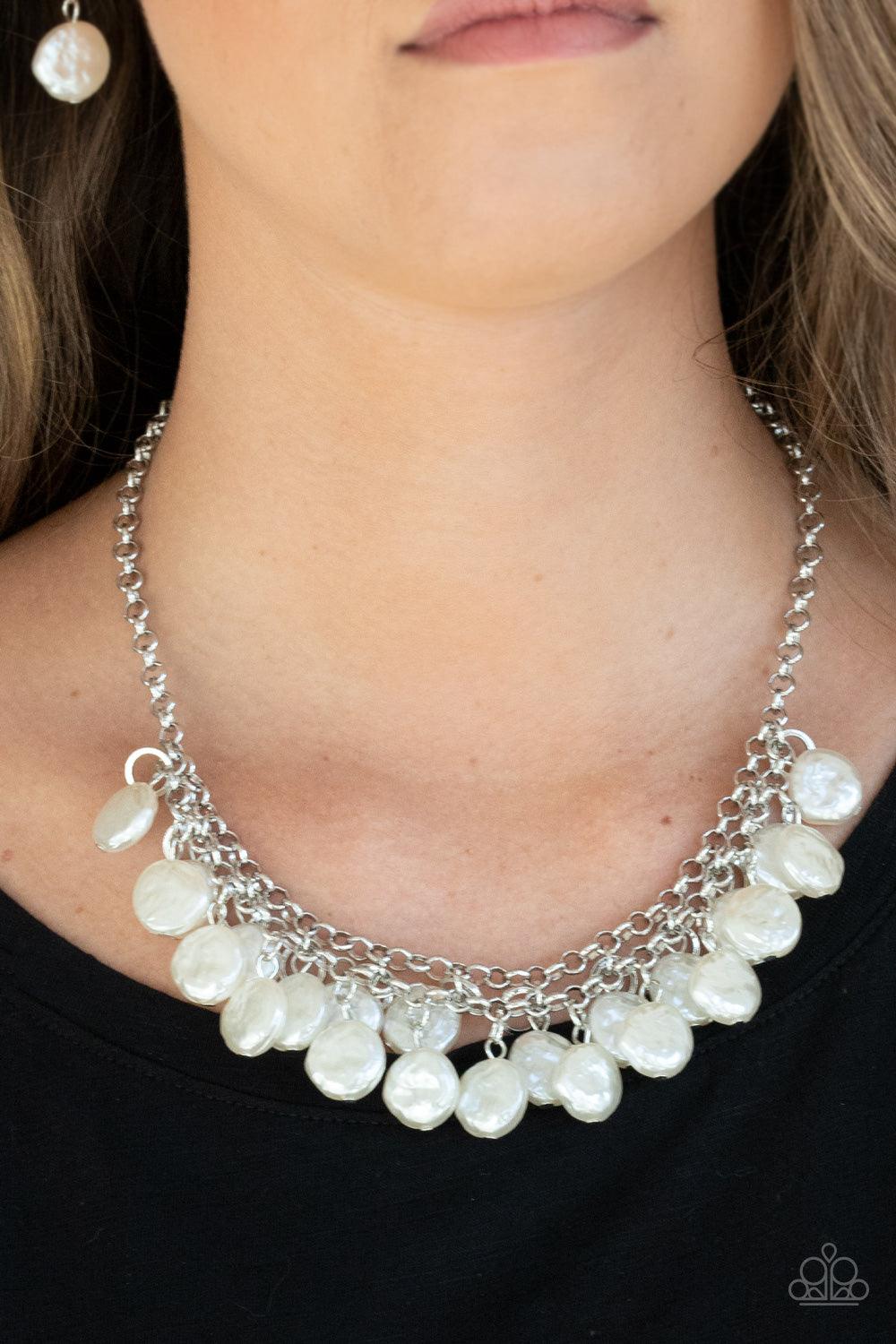 Paparazzi Accessories BEACHFRONT and Center - White Featuring delicately hammered surfaces, rows of pearly white beads cascade from the bottoms of interlocking silver chains. Dainty silver rings swing from the top of the timelessly tiered display, creatin