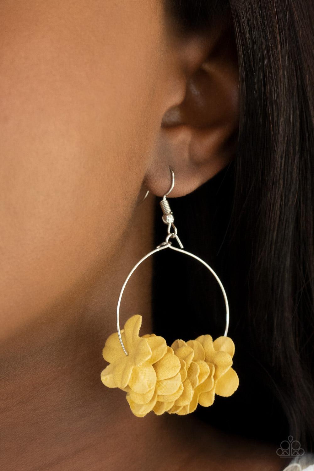 Paparazzi Accessories Flirty Florets - Yellow Featuring the sunny shade of Illuminating, a collection of yellow paper-like flowers are threaded along a dainty silver hoop, creating a flirtatious floral fringe. Earring attaches to a standard fishhook fitti