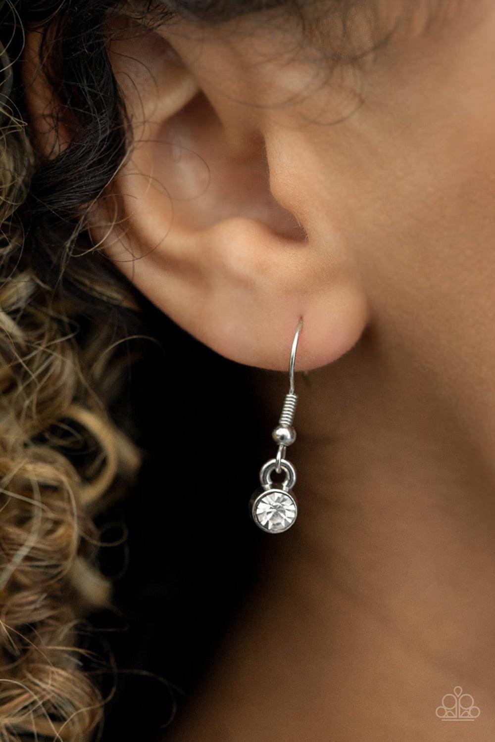 Paparazzi Accessories HEIRESS of Them All - White Bubbly white pearls and regally cut white rhinestones coalesce into blinding frames that glamorously link below the collar, creating a timeless fringe. Features an adjustable clasp closure. Sold as one ind