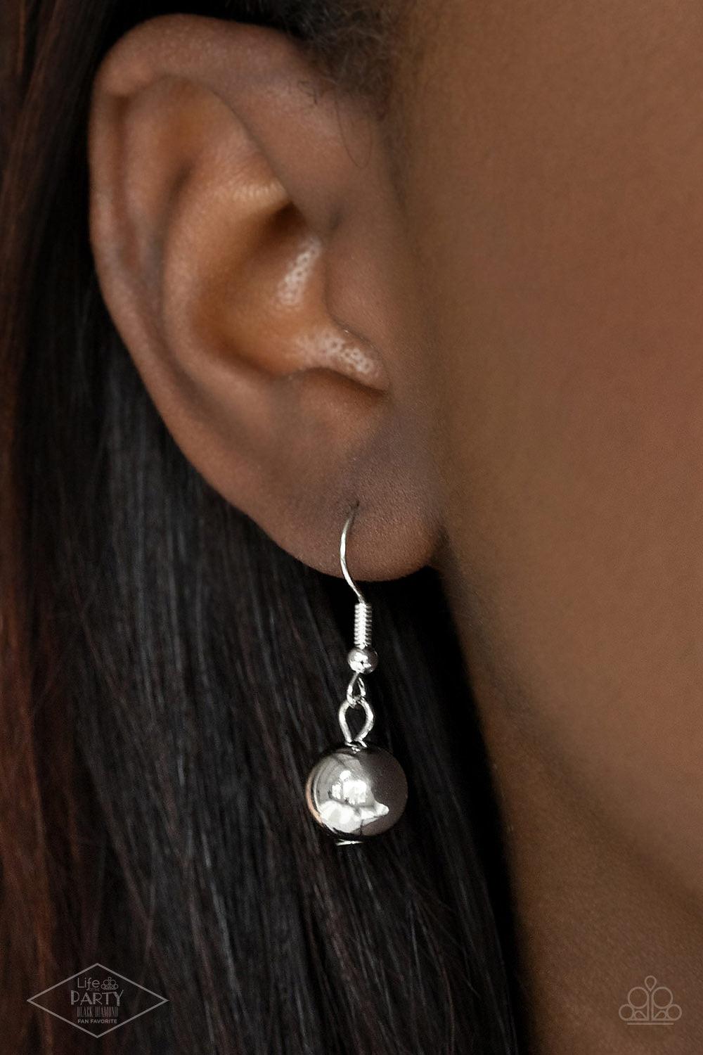 Paparazzi Accessories Forbidden Love - Black Featuring chunky silver beads, an oversized silver heart pendant swings from dramatic silver hook-like fittings that attach to a bold leather cord draped across the chest for a haute heartbreaker look. Features