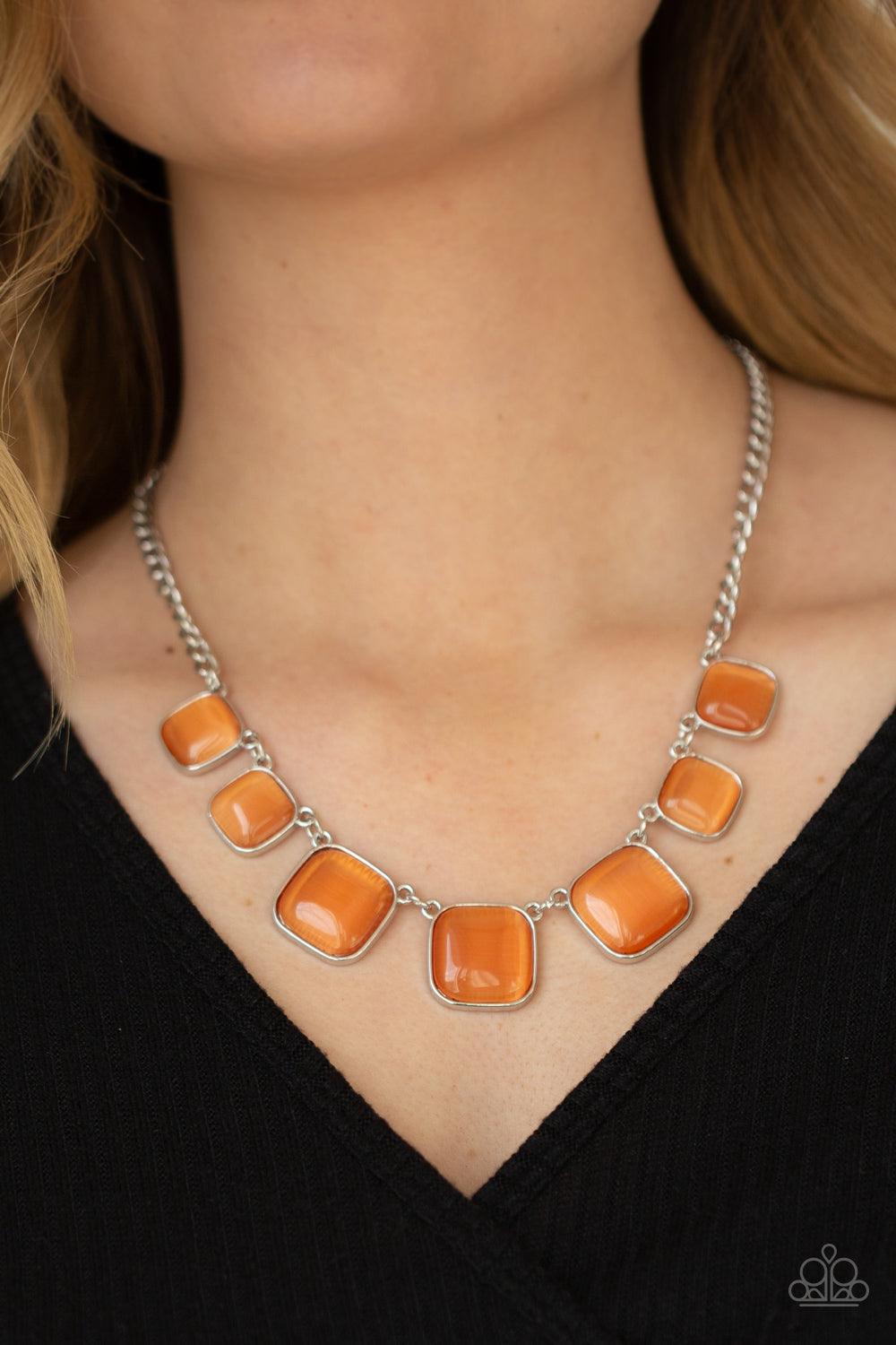 Paparazzi Accessories Aura Allure - Orange Encased in square silver fittings, a dewy collection of orange cat's eye stones gradually increase in size as they link below the collar for a whimsical pop of color. Features an adjustable clasp closure. Sold as