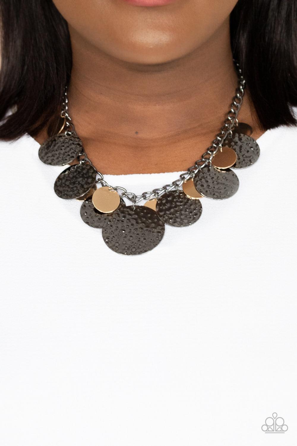 Paparazzi Accessories Industrial Grade Glamour - Multi Oversized gold discs and hammered gunmetal discs swing from the bottom of a chunky gunmetal chain, creating a rambunctious fringe below the collar. Features an adjustable clasp closure. Sold as one in