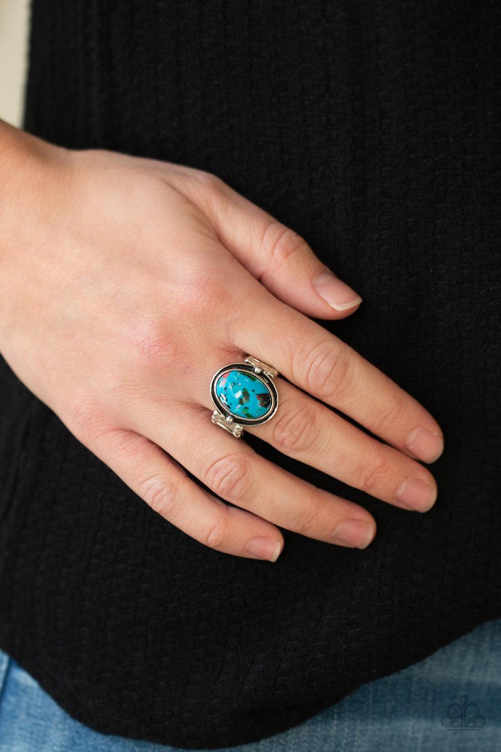 Paparazzi Accessories Terrifically Terrazzo - Blue Featuring a colorful terrazzo finish, a marbled blue stone is pressed into the center of a stacked silver frame for a funky pop of color. Features a stretchy band for a flexible fit. Sold as one individua