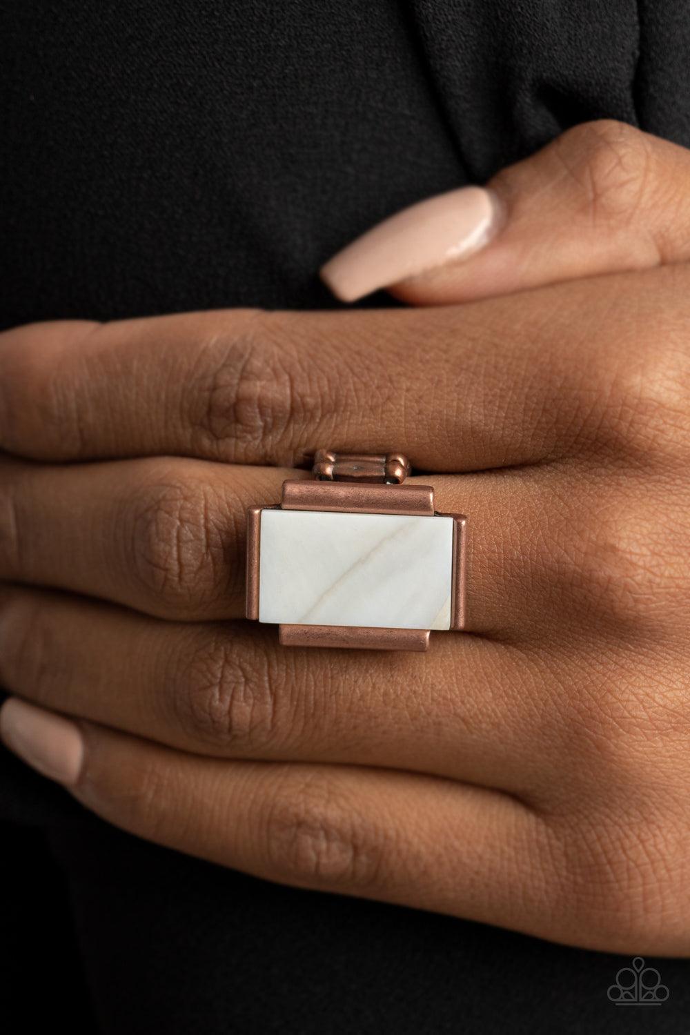 Paparazzi Accessories Mystical Marinas - Copper Featuring an iridescent shimmer, a white shell-like rectangle is nestled between copper bar-like fittings atop the finger for a mystical look. Features a stretchy band for a flexible fit. Sold as one individ