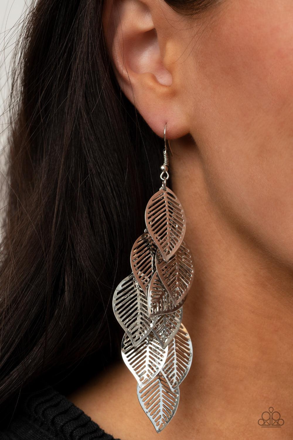 Paparazzi Accessories Limitlessly Leafy - Silver Stenciled silver leaf frames cascade from a silver netted fitting, creating a shimmery leafy fringe. Earring attaches to a standard fishhook fitting. Sold as one pair of earrings. Jewelry