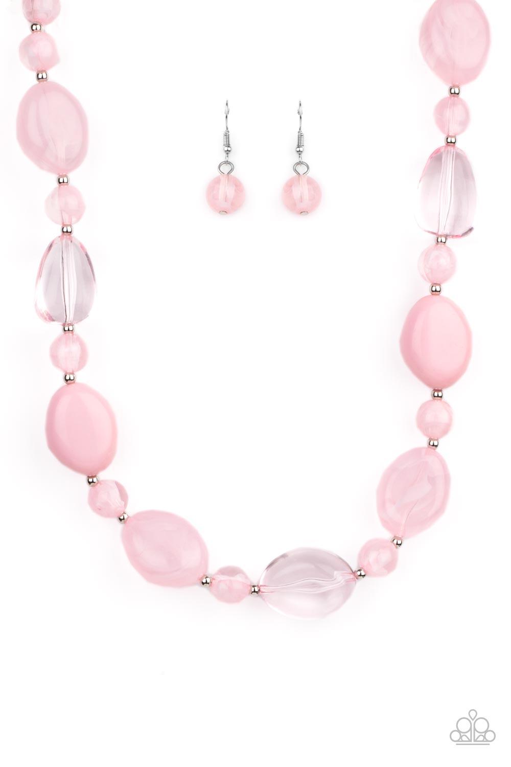 Paparazzi Accessories Staycation Stunner - Pink Featuring glassy, opaque, and solid finishes, an array of pink faux stone beads and dainty silver beads are threaded along an invisible wire below the collar, creating a colorful statement piece. Features an