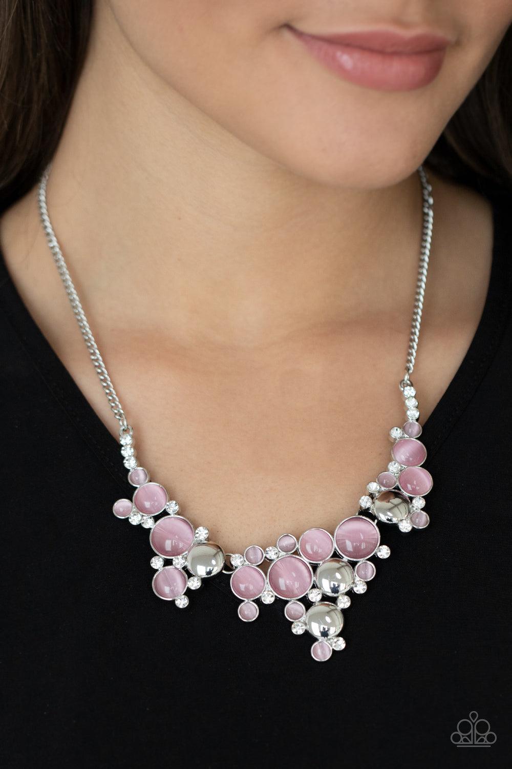 Paparazzi Accessories Fairytale Affair - Pink A bubbly collection of glowing pink cat's eye stones, glassy white rhinestones, and shiny silver discs delicately coalesces into enchanting frames below the collar that link into a whimsical centerpiece. Featu