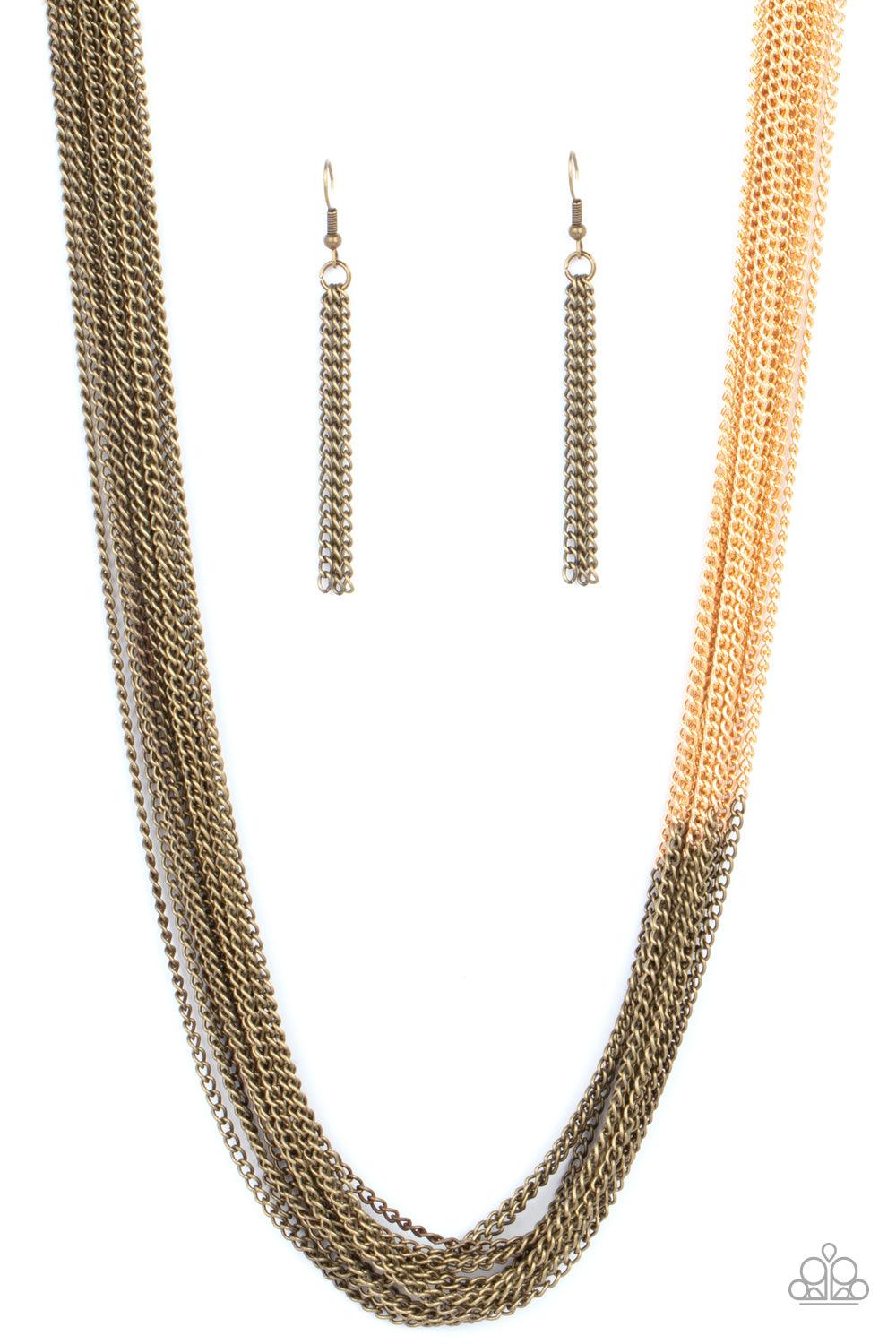 Paparazzi Accessories Metallic Merger - Brass Sections of rustic brass chains collide with shimmery gold chains below the collar, linking into dramatic layers for an edgy effect. Features an adjustable clasp closure. Sold as one individual necklace. Inclu