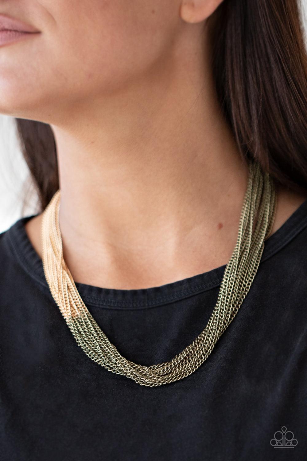 Paparazzi Accessories Metallic Merger - Brass Sections of rustic brass chains collide with shimmery gold chains below the collar, linking into dramatic layers for an edgy effect. Features an adjustable clasp closure. Sold as one individual necklace. Inclu