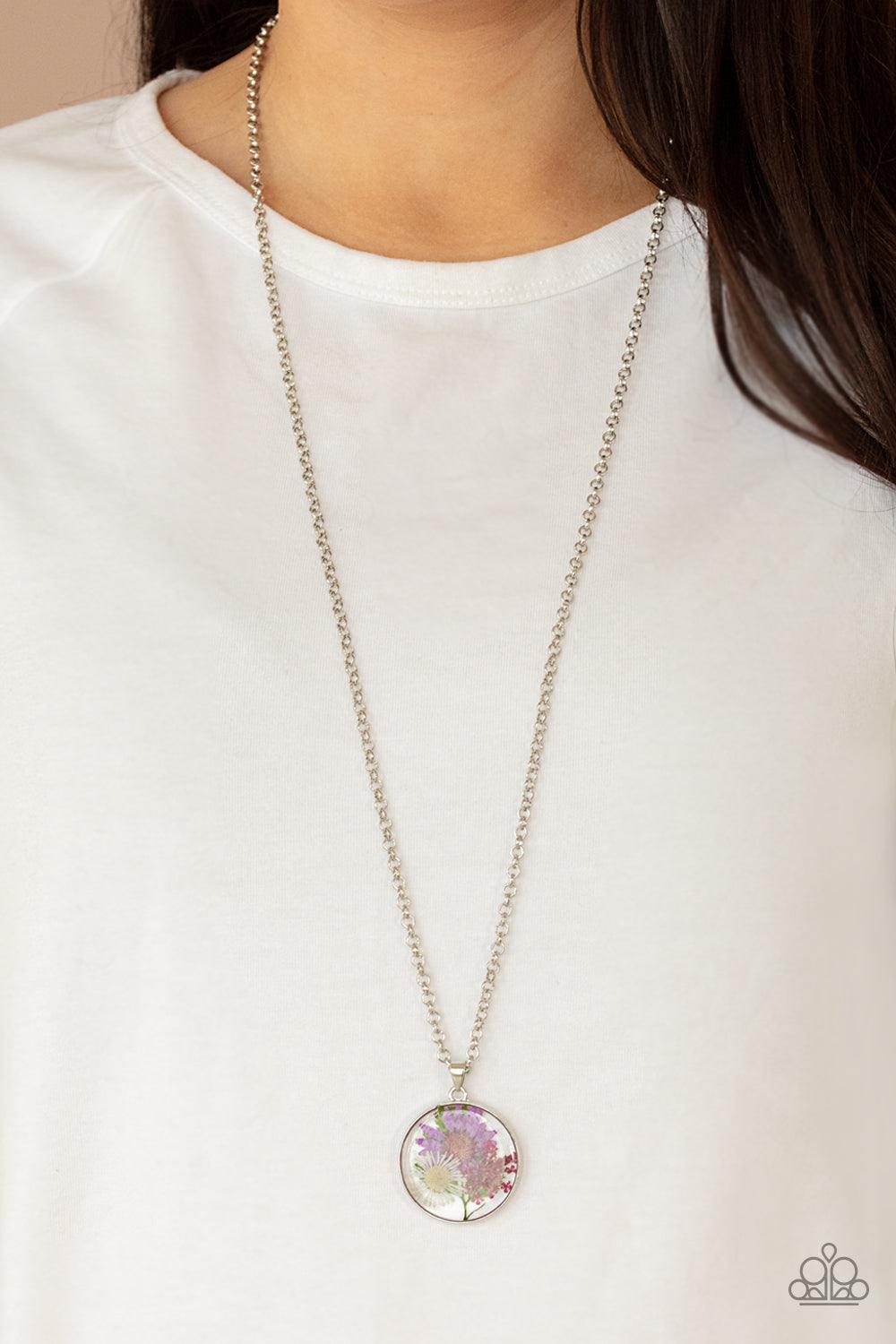Paparazzi Accessories Evergreen Eden - Multi A leafy collection of colorful wildflowers is encased inside a glassy frame, creating a whimsical pendant at the bottom of the lengthened silver chain. Features an adjustable clasp closure. Sold as one individu