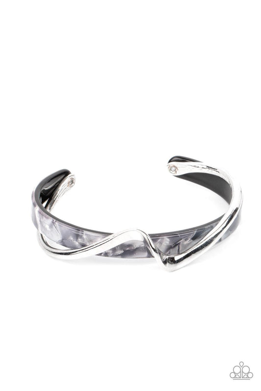Paparazzi Accessories Craveable Curves - Silver A flat silver bar delicately curls across a dainty gray shell-like acrylic cuff, creating a whimsical centerpiece around the wrist. Sold as one individual bracelet. Jewelry