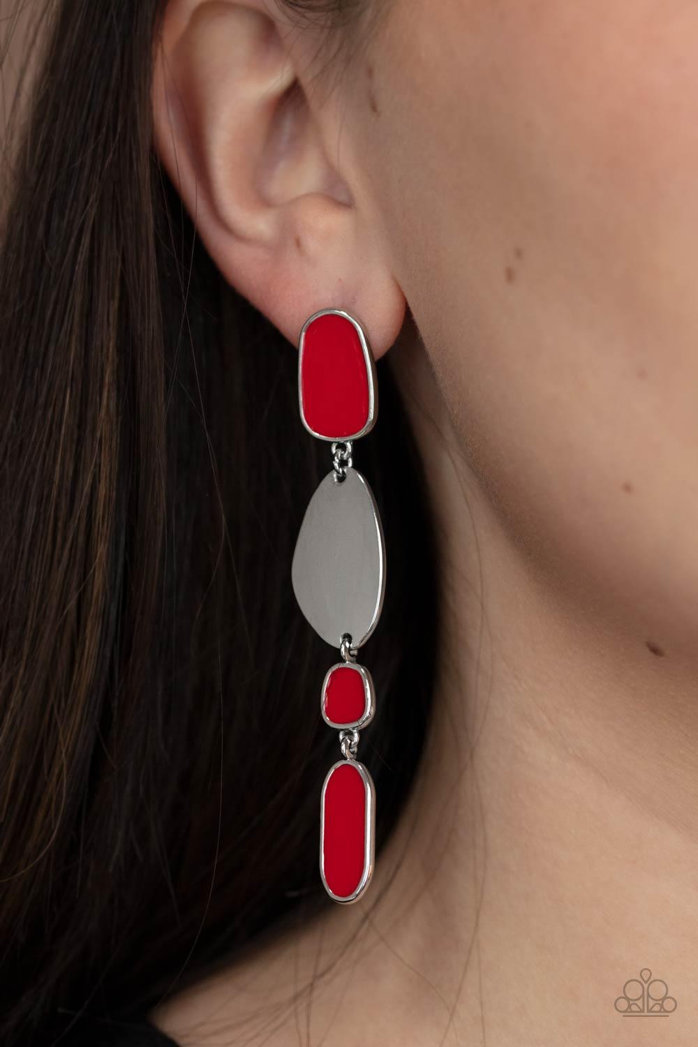 Paparazzi Accessories Deco By Design - Red Painted in a fiery red finish, a shiny collection of asymmetrical frames link with a glistening silver frame, creating an abstract lure. Earring attaches to a standard post fitting. Sold as one pair of post earri