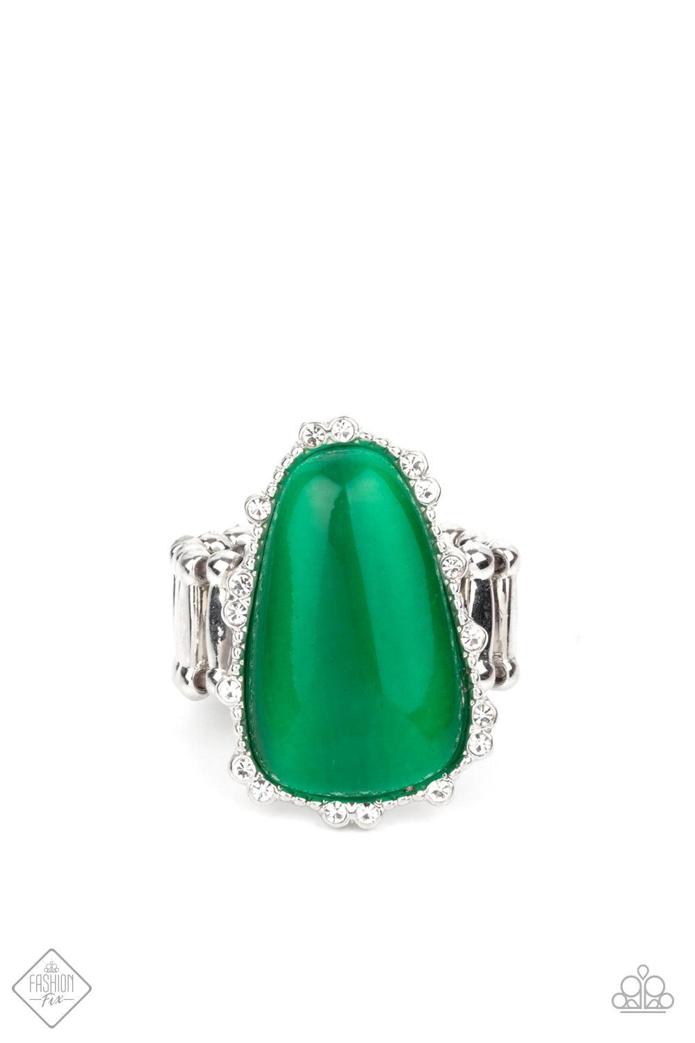 Paparazzi Accessories Newport Nouveau - Green A tranquil asymmetrical Mint cat’s eye stone teardrop is nestled inside a studded silver frame sporadically dotted in dainty white rhinestones, creating an elegantly enchanting centerpiece atop the finger. Fea