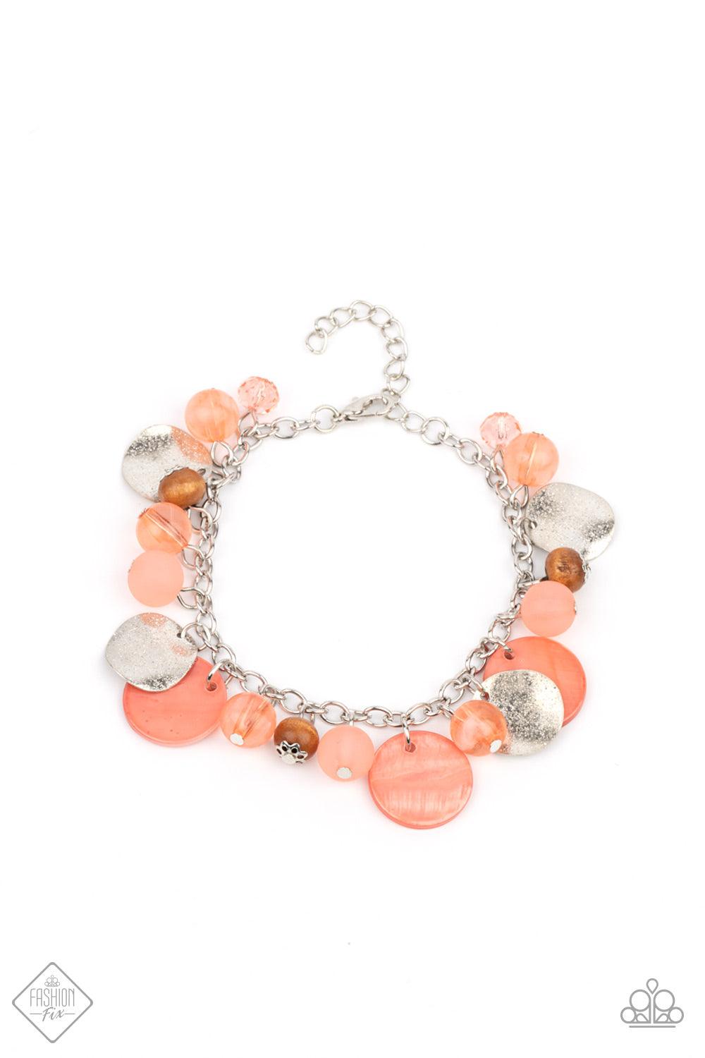 Paparazzi Accessories Springtime Springs - Orange Springtime charms of shiny and soft beads and pearl-like discs in lovely tones of Burnt Coral sway from a silver chain. Accents of sparkly, wavy silver discs and wooden beads bring it down to earth as the