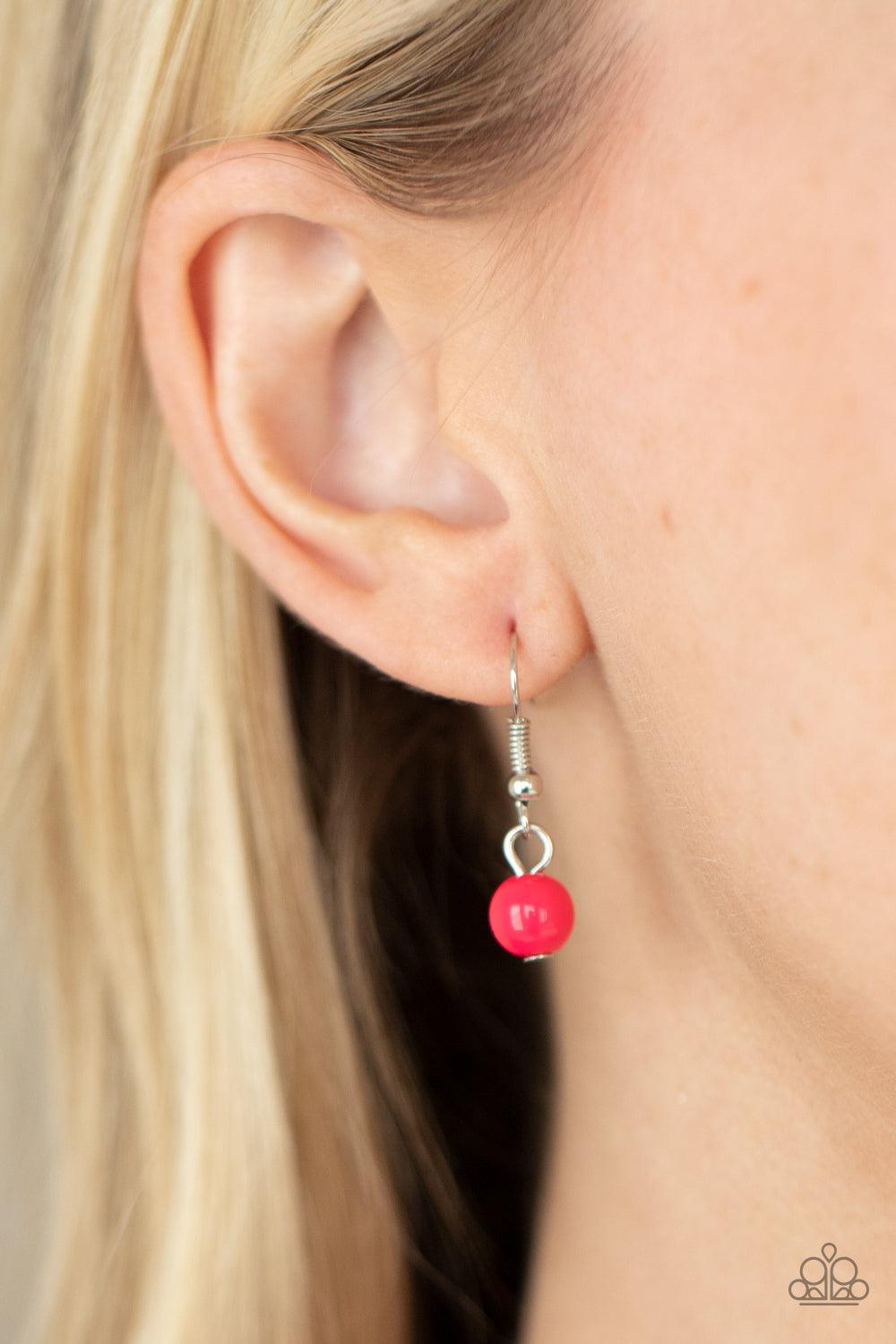 Paparazzi Accessories STAYCATION All I Ever Wanted - Pink A colorful collection of polished pink beads, faceted silver beads, and opaque pink beads are threaded along invisible wires across the chest, creating vivacious layers. Features an adjustable clas