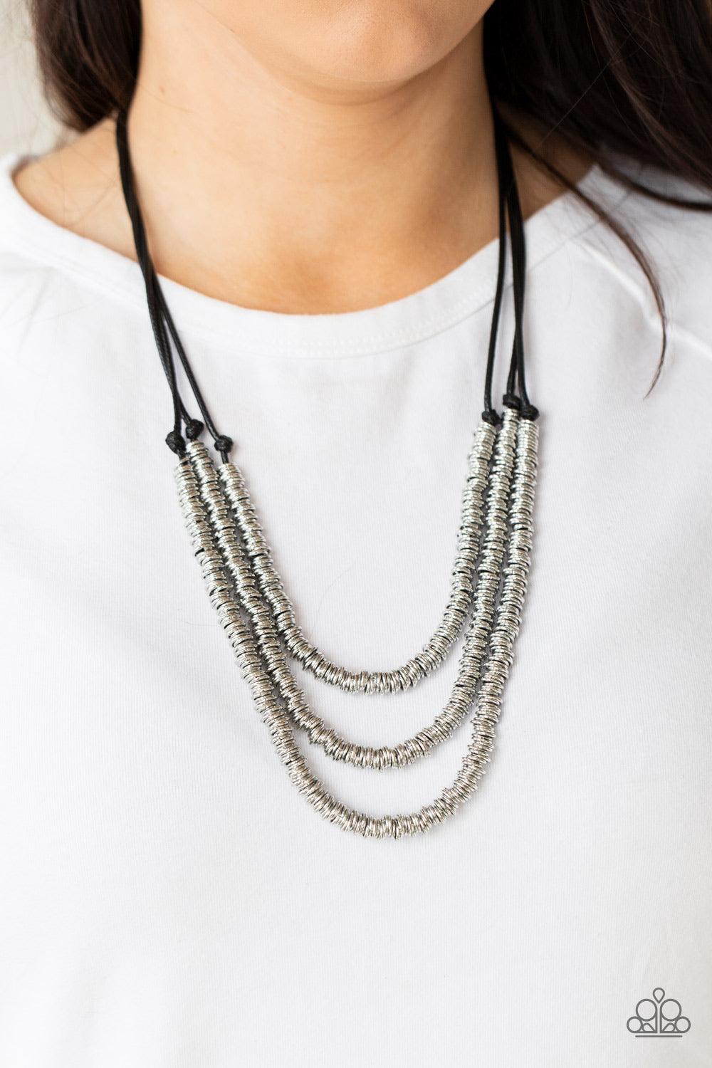 Paparazzi Accessories RING to Reason - Black A seemingly infinite collection of dainty silver rings are knotted in place along three black cords, creating edgy layers across the chest. Features an adjustable clasp closure. Sold as one individual necklace.