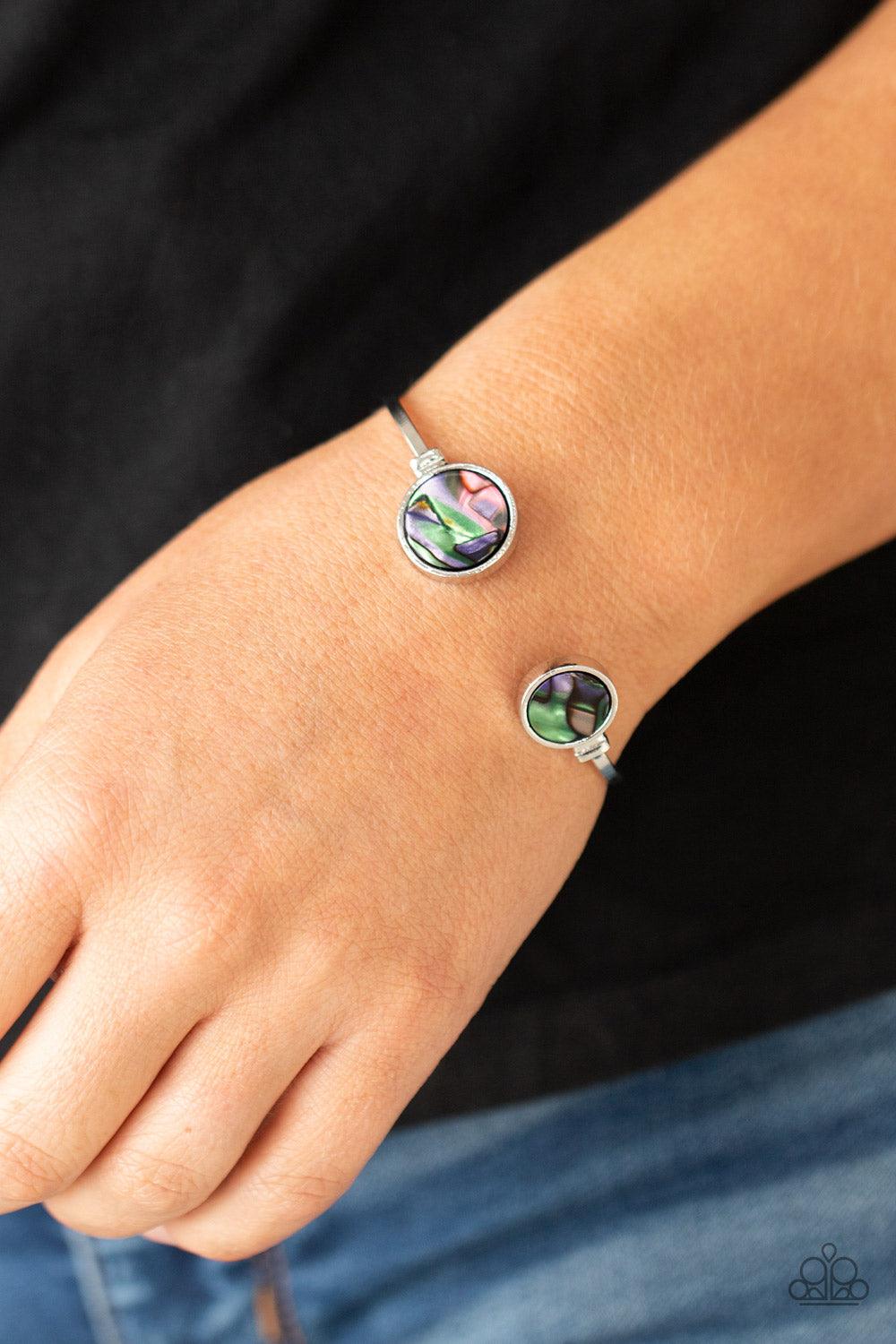 Paparazzi Accessories Space Oracle - Multi Encased in sleek silver frames, iridescent multicolored shell-like fittings adorn the ends of a dainty silver cuff, creating a colorful open-face display. Sold as one individual bracelet. Bracelets