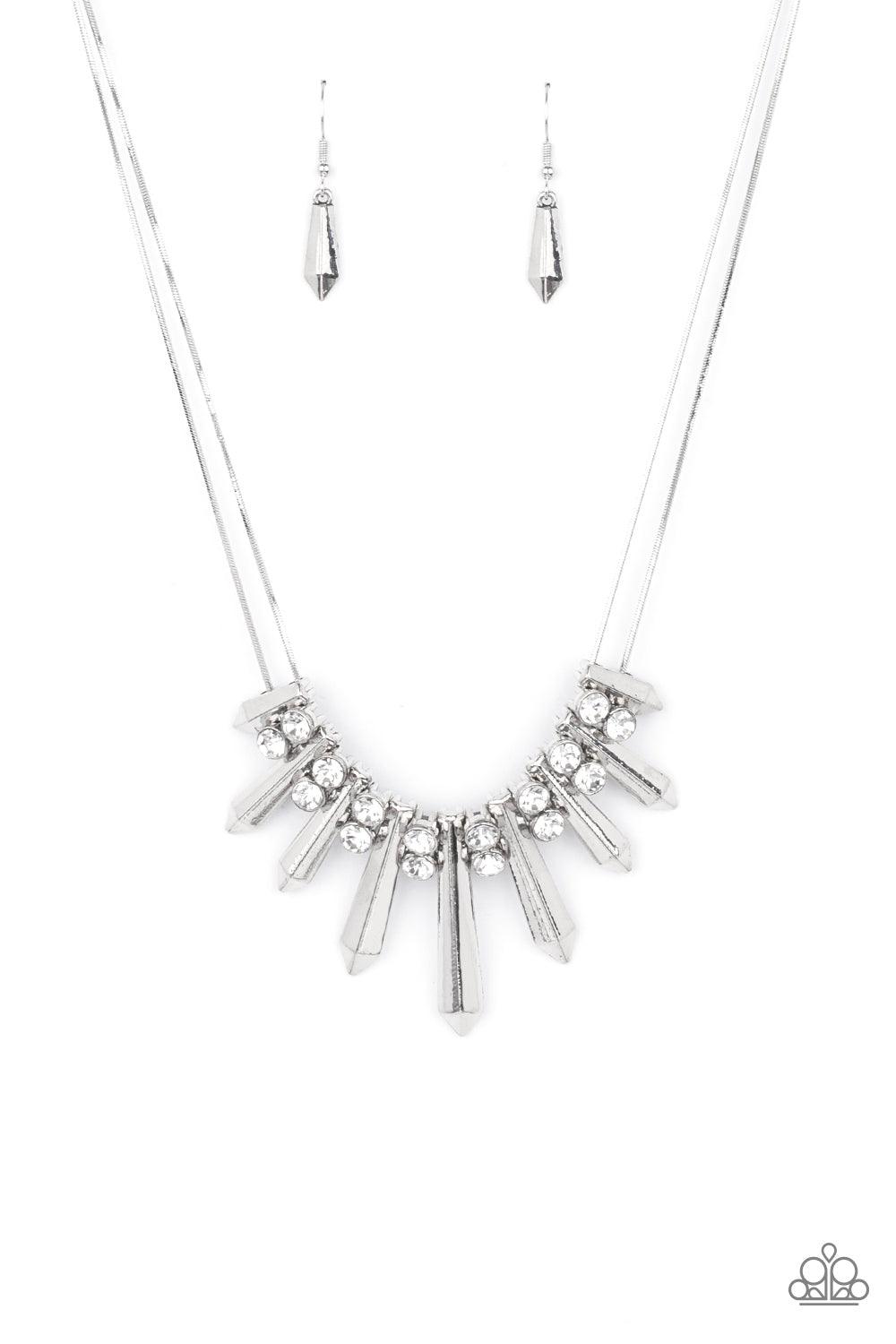 Paparazzi Accessories Dangerous Dazzle - White Pairs of glittery white rhinestones alternate between flared silver rods that are threaded along two rows of flat silver chains, creating a dangerous fringe below the collar. Features an adjustable clasp clos