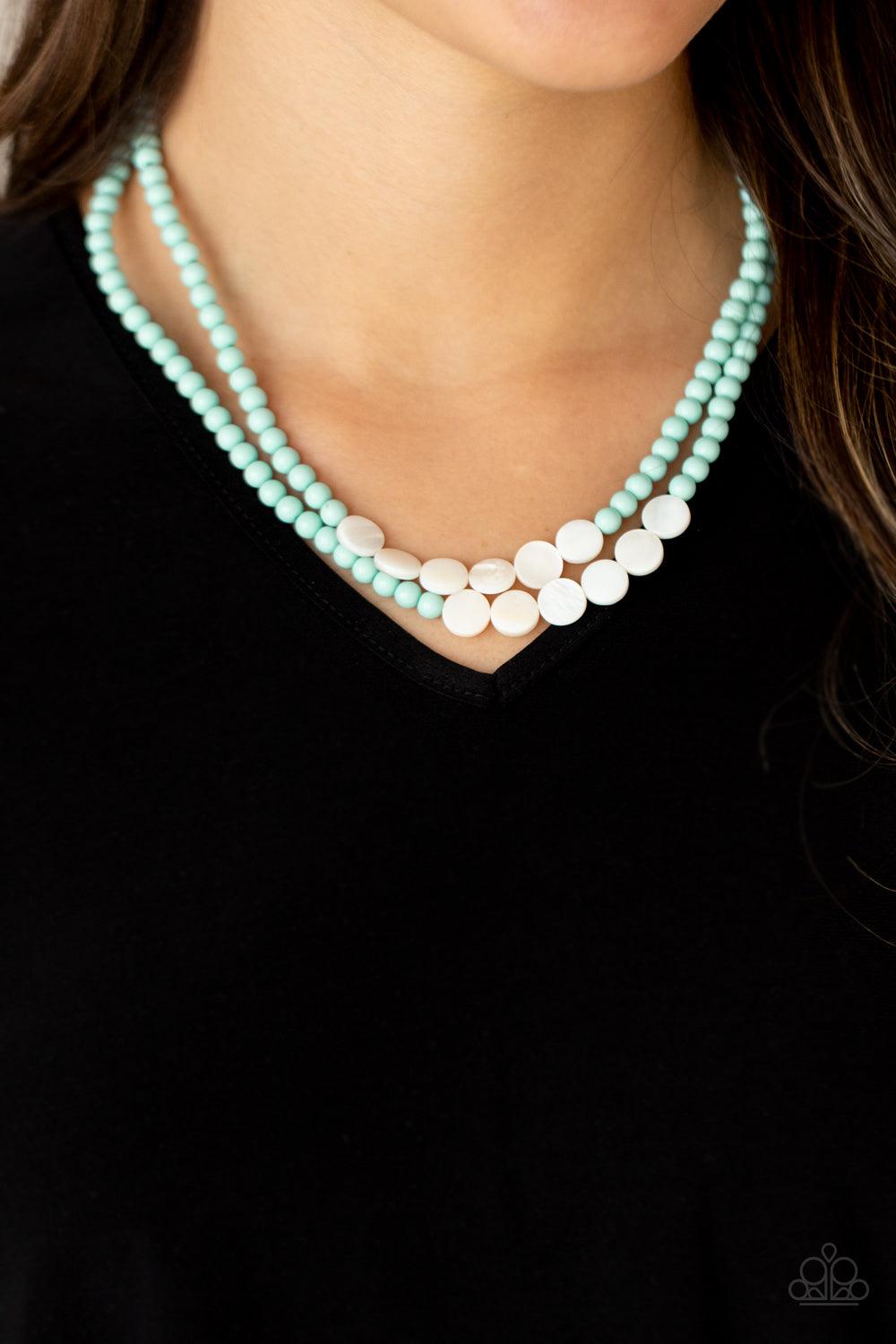Paparazzi Accessories Extended STAYCATION - Blue A summery collection of shiny white shell-like discs and dainty blue beads are threaded along invisible wire, creating colorful layers below the collar. Features an adjustable clasp closure. Sold as one ind