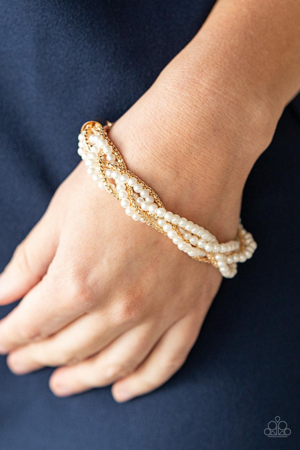 Paparazzi Accessories Vintage Variation - Gold Capped in gold fittings, strands of bubbly white pearls and dainty gold popcorn chains delicately weave around the wrist, creating an elegantly effervescent display. Features an adjustable clasp closure. Sold