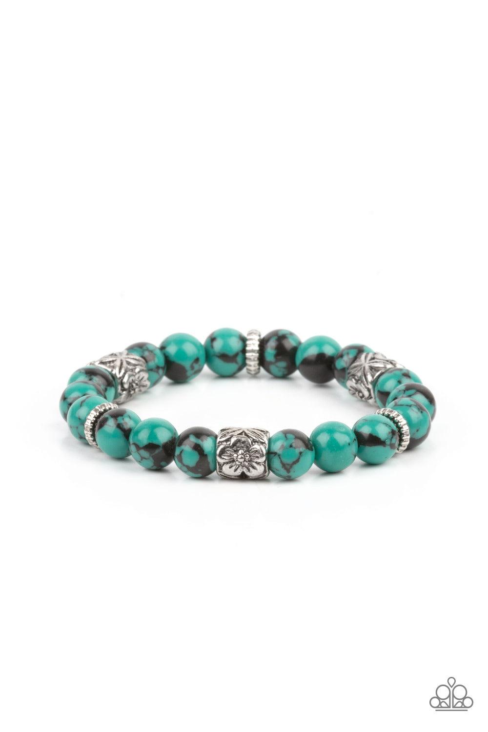 Paparazzi Accessories Garden Zen - Green An earthy collection of glassy green and black beads, textured silver rings, and floral embossed beads are threaded along stretchy bands around the wrist, creating a seasonal centerpiece. Sold as one individual bra