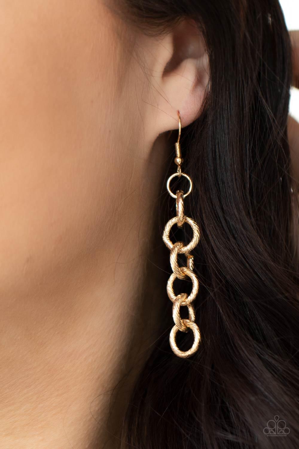Paparazzi Accessories Grunge Goals - Gold A seemingly infinite collection of textured shiny gold links connect into two dramatic rows across the chest, creating an intense industrial display. Features an adjustable clasp closure. Sold as one individual ne
