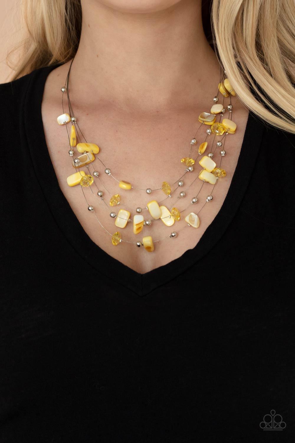 Paparazzi Accessories Prismatic Pebbles - Yellow Dainty silver beads, yellow crystal-like beads, and shell-like yellow pebbles are fitted in place along strands of dainty wires, creating colorful layers below the collar. Features an adjustable clasp closu
