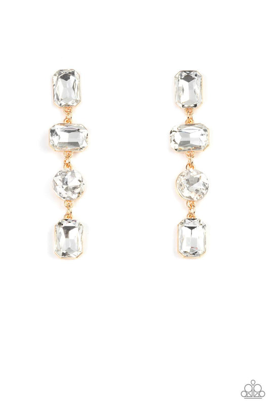 Paparazzi Accessories Cosmic Heiress - Gold A strand of oversized round, teardrop, and emerald cut white rhinestones trickles from the ear, creating a jaw-dropping golden chandelier. Earring attaches to a standard post earring. Sold as one pair of post ea