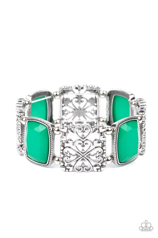 Paparazzi Accessories Colorful Coronation - Green Infused with dainty silver heart accents, whimsically filled silver filigree frames and faceted Mint beads are threaded along stretchy bands around the wrist for a colorful flair. Sold as one individual br