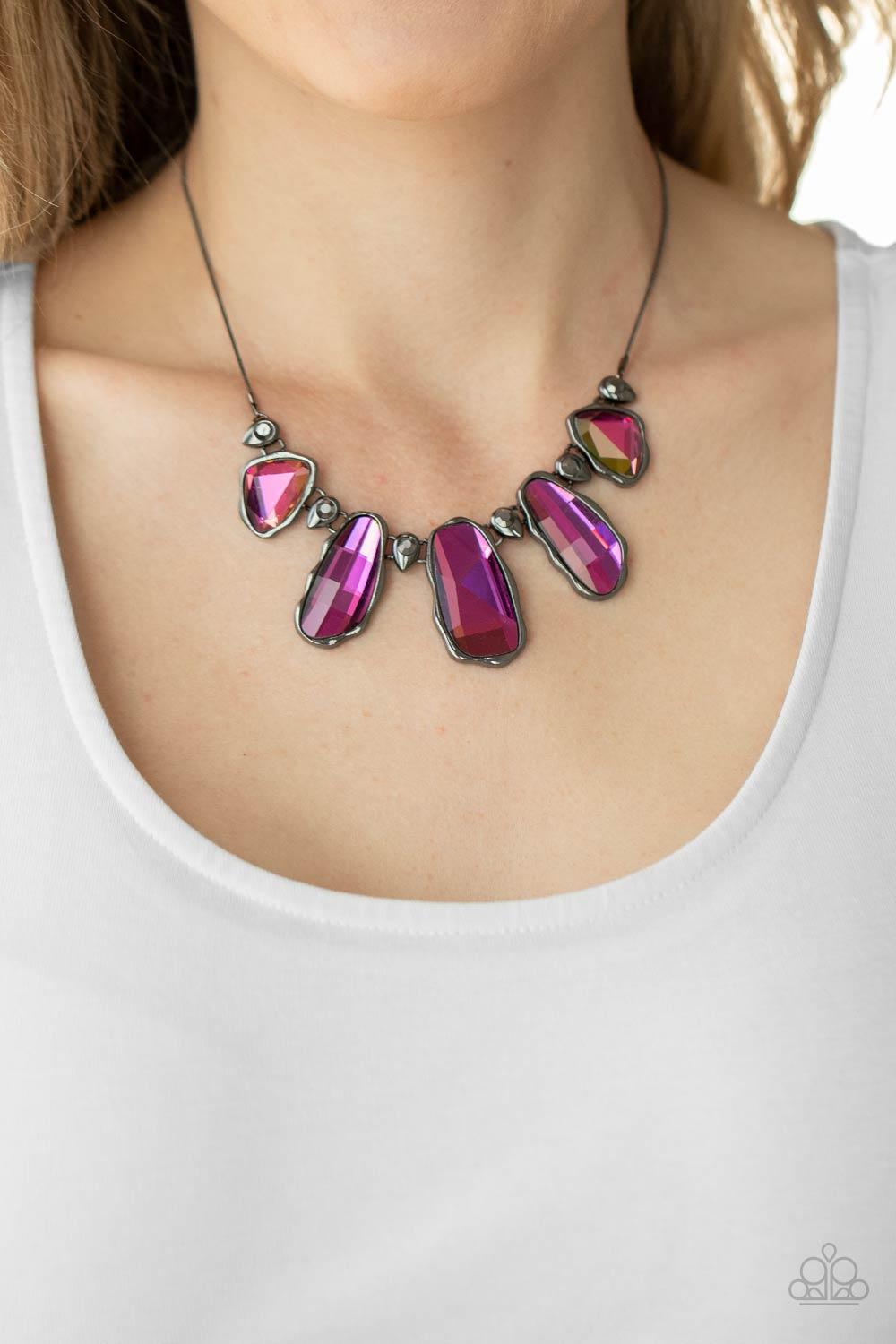 Paparazzi Accessories Cosmic Cocktail - Multi Featuring a UV shimmer, a glittery collection of raw cut iridescent gems delicately link with dainty hematite rhinestone dotted gunmetal teardrops below the collar, creating a stellar fringe. Features an adjus