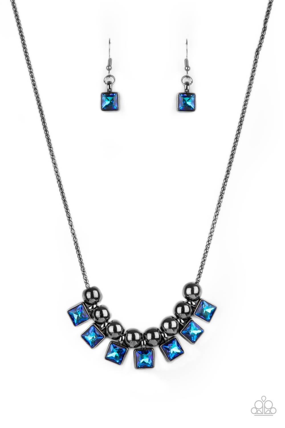 Paparazzi Accessories Graciously Audacious - Blue Featuring a UV shimmer, light and dark blue square rhinestone frames and oversized gunmetal beads alternate along a gunmetal popcorn chain, creating a stellar fringe below the collar. Features an adjustabl