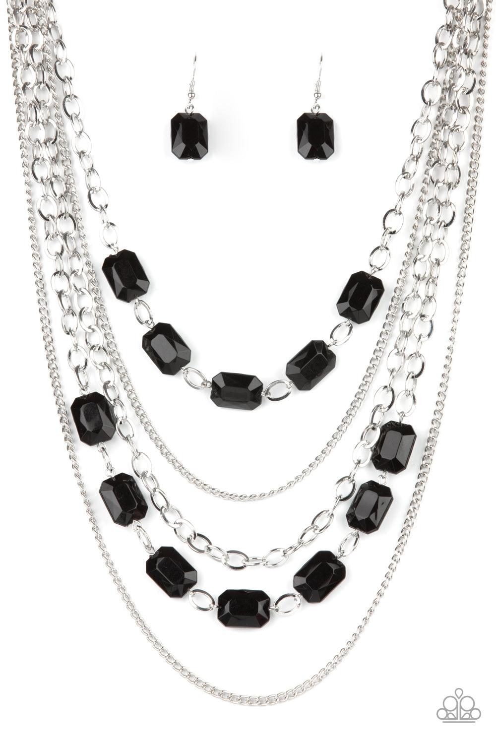 Paparazzi Accessories Standout Strands - Black A stunning collection of silver chains and shiny rectangular black beads, falls in layers across the chest for a glamorous standout statement. Features an adjustable clasp closure. Sold as one individual neck