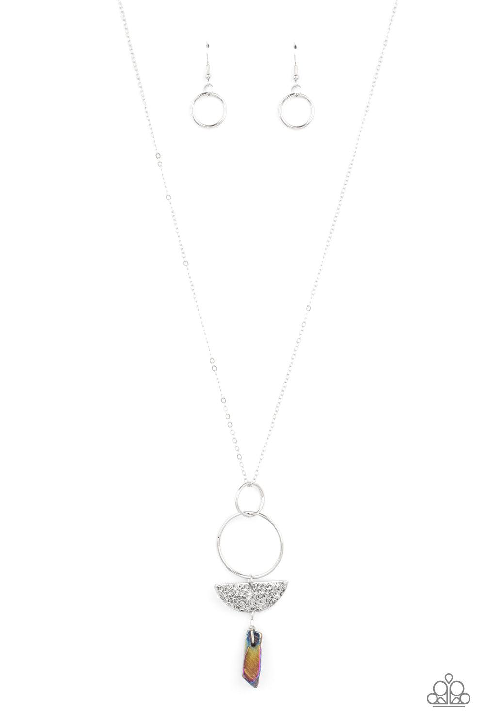 Paparazzi Accessories Monumental Obelisk - Multi Silver hoops, a slice of textured semi-circle disc, and a hammered multicolored stone-like obelisk pendant all dangle from a long chain for a trend-setting combination. Features an adjustable clasp closure.