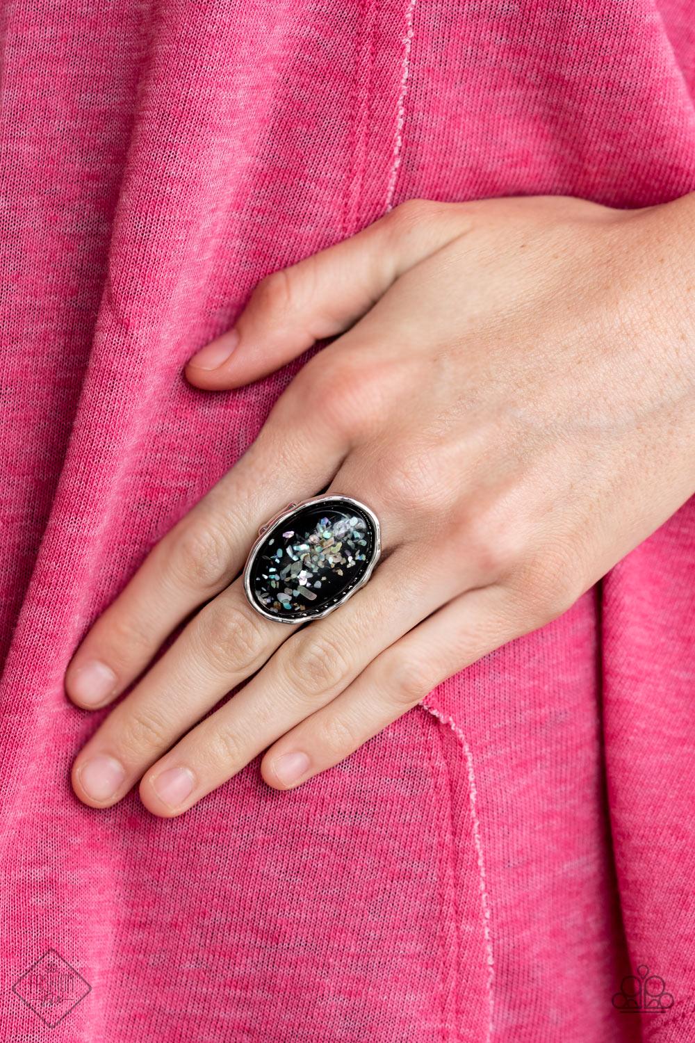 Paparazzi Accessories Glittery With Envy - Black Encased in an imperfectly hammered silver frame, flecks of shell-like pieces are encased inside an oversized glassy black bead for a bubbly effect. Features a stretchy band for a flexible fit. Sold as one i