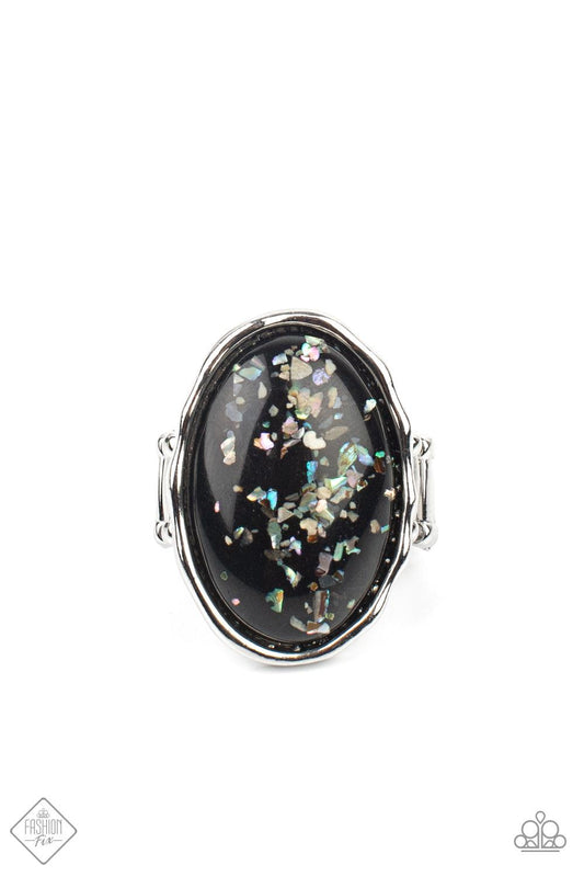 Paparazzi Accessories Glittery With Envy - Black Encased in an imperfectly hammered silver frame, flecks of shell-like pieces are encased inside an oversized glassy black bead for a bubbly effect. Features a stretchy band for a flexible fit. Sold as one i