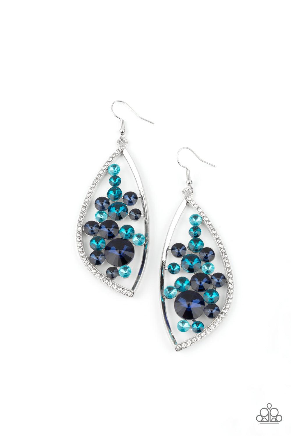 Paparazzi Accessories Sweetly Effervescent - Blue A bubbly collection of light to dark blue rhinestones coalesce inside an asymmetrical silver frame. One side of the frame is encrusted in glassy white rhinestones, adding a refined flair to the bubbly lure