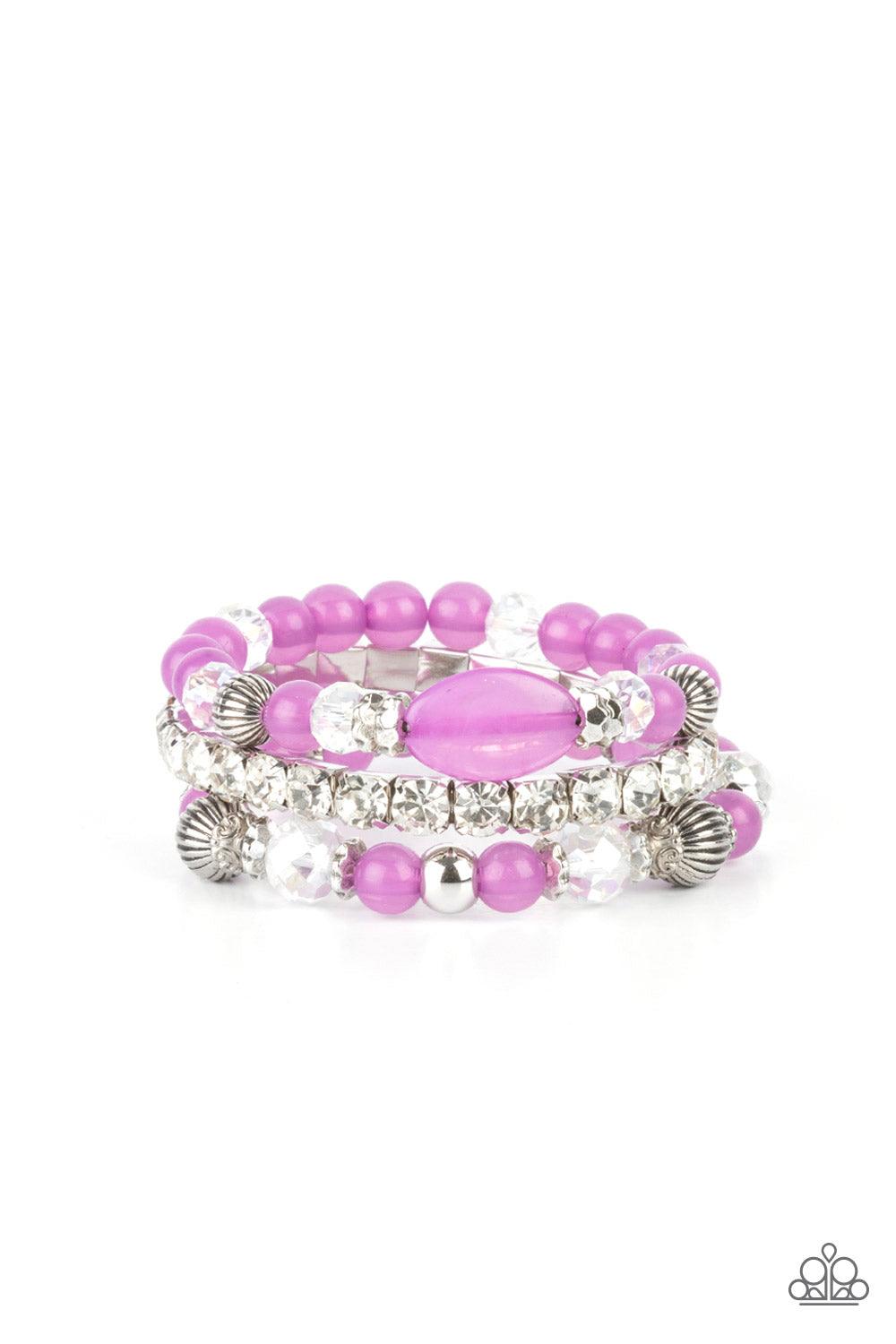 Paparazzi Accessories Ethereal Etiquette - Purple Infused with a stretchy strand of glassy white rhinestones, a mismatched collection of cloudy Amethyst Orchid, white crystal-like, and ornate silver accents are threaded along stretchy bands around the wri