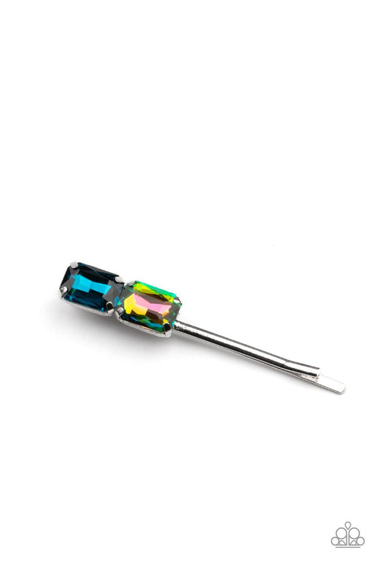 Paparazzi Accessories Material Girl Goals - Blue Featuring elegant emerald style cuts, an oversized pair of blue and oil spill rhinestones adorn the end of a classic silver bobby pin. Sold as one individual bobby pin. Brooches & Lapel Pins