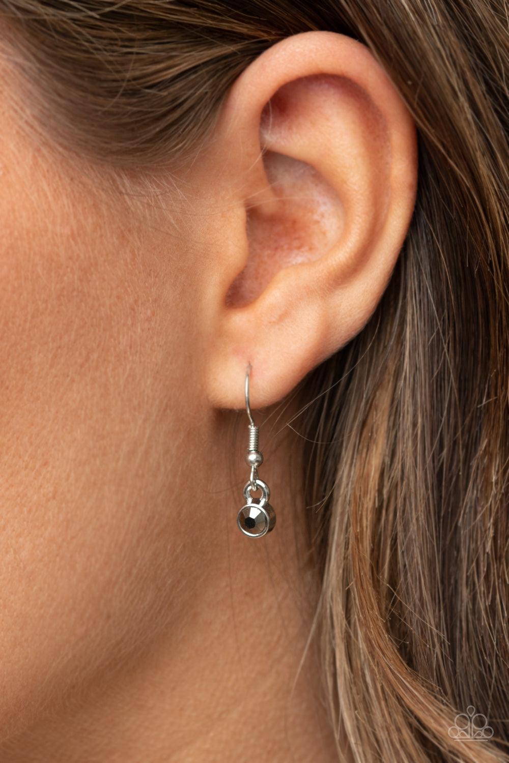 Paparazzi Accessories The Real Boss - Silver Infused with a smoky hematite rhinestone encrusted silver heart, a silver heart shaped pendant is stamped in the word, "Mom," as it swings below the collar, creating a sparkly sentimental statement piece. Featu