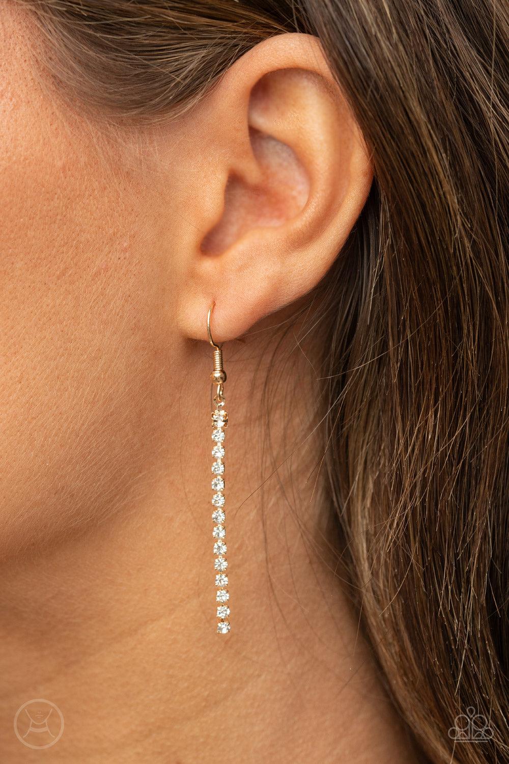 Paparazzi Accessories Starlight Radiance - Gold A strand of brilliant white rhinestones set in classic gold fittings creates a stunningly radiant display across the collar. Features an adjustable clasp closure. Sold as one individual choker necklace. Incl