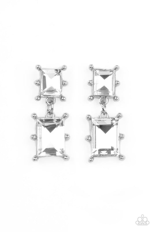 Paparazzi Accessories Cosmic Queen - White Two brilliant baguette cut white rhinestones, set in classic silver pronged settings, stack one over the other creating a cosmically radiant statement. Earring attaches to a standard post fitting. Sold as one pai