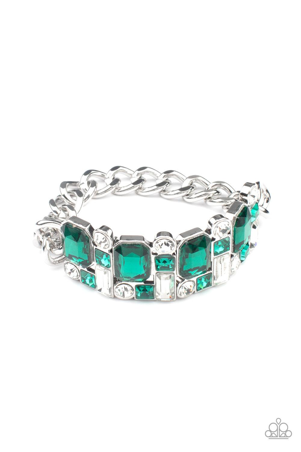 Paparazzi Accessories Urban Crest - Green A mismatched collision of green and white rhinestone encrusted frames are threaded along a stretchy band that attaches to a chunky strand of silver chain, creating a jaw-dropping dazzle across the front of the wri