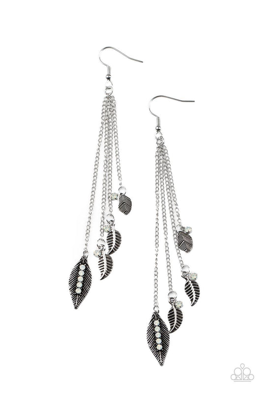 Paparazzi Accessories Chiming Leaflets - White A collection of textured antiqued silver leaflets accented with dewdrop opal rhinestones, swing from delicate silver chains creating a tranquil chime as it falls from the ear. Earring attaches to a standard f