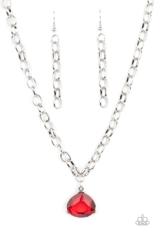Paparazzi Accessories Gallery Gem - Red An oversized glassy red gem is pressed into a pronged silver fitting at the bottom of a chunky silver chain, creating a dramatic pendant below the collar. Features an adjustable clasp closure. Sold as one individual