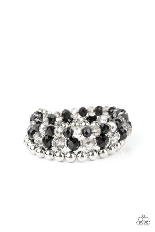 Paparazzi Accessories Gimme Gimme - Black Sections of shiny silver beads and an alternating pattern of smoky and glittery black rhinestone gems gradually increase in size along a coiled wire, creating a jaw-dropping infinity wrap bracelet around the wrist