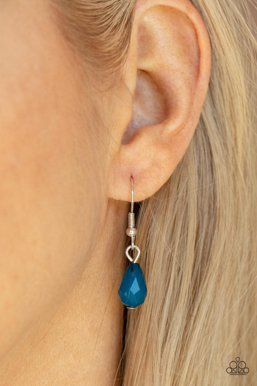 Paparazzi Accessories Garden Fairytale - Blue A shimmery collection of opaque and clear crystal-like Mykonos Blue teardrop beads delicately cluster along a linked strand of silver bars, creating an ethereally leafy fringe below the collar. Features an adj